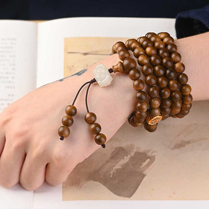 Bracelet Mala tibétain de protection et de calme en bois de rose avec Buddha Stones