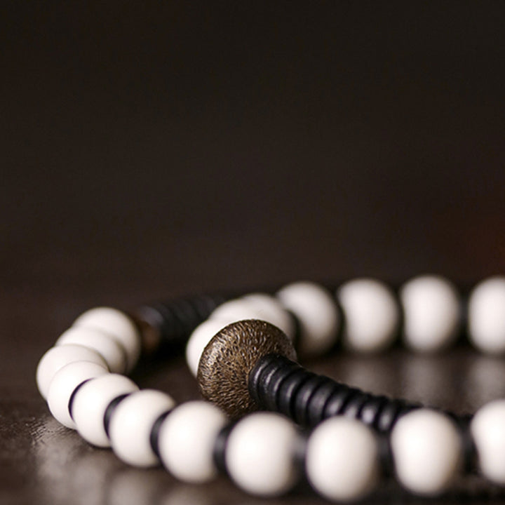 Bracelet couple force en bois d'ébène et cuivre, perles d'os et Buddha Stones