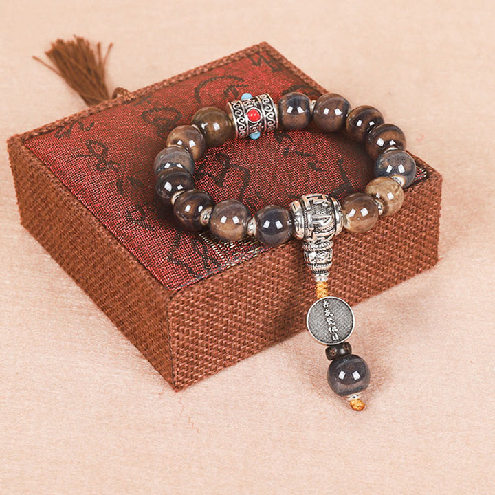 Bracelet de sagesse en perles de verre gravées Buddha Stones et roue de prières tibétaines Om Mani Padme Hum Dorje Vajra