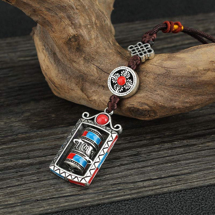 Porte-clés décoratif avec nœud rotatif et bénédiction en forme de roue de prière en six mots vrais en Buddha Stones