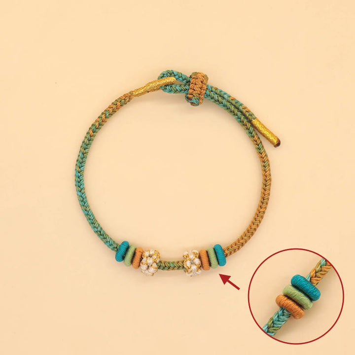 Bracelet tressé fait main en corde porte-bonheur avec nœud de paix à huit fils et nœud de fleur de pêcher en Buddha Stones - image 3