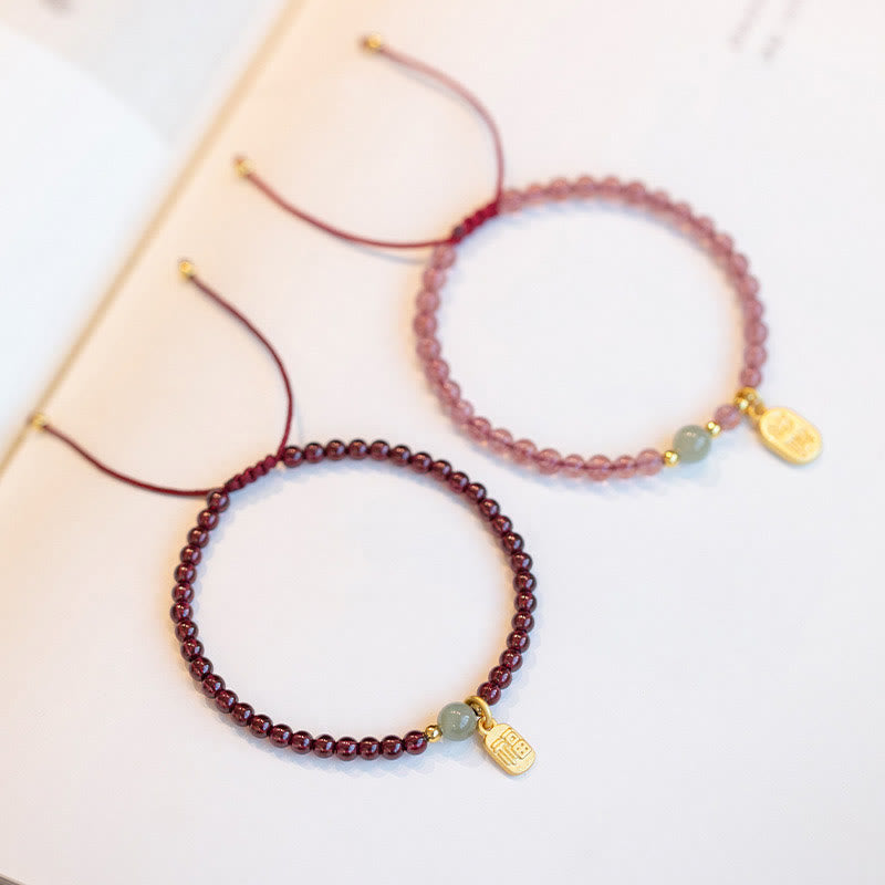 Bracelet porte-bonheur en Buddha Stones, quartz fraise, grenat, jade, caractère Fu