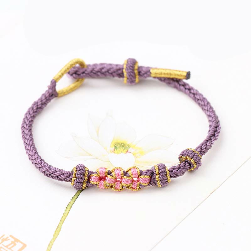 Bracelet tressé fait main à huit brins avec trois fleurs de pêcher et Buddha Stones