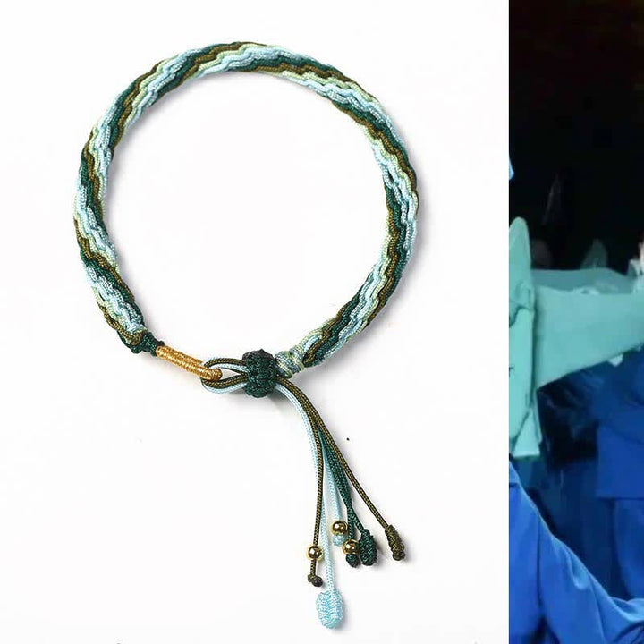 Bracelet tressé de protection avec cordon porte-bonheur et nœud de réincarnation