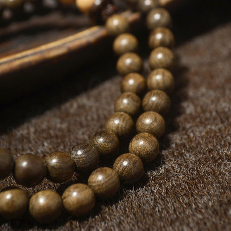 Bracelet Mala avec breloque de protection en bois de santal tibétain et Buddha Stones
