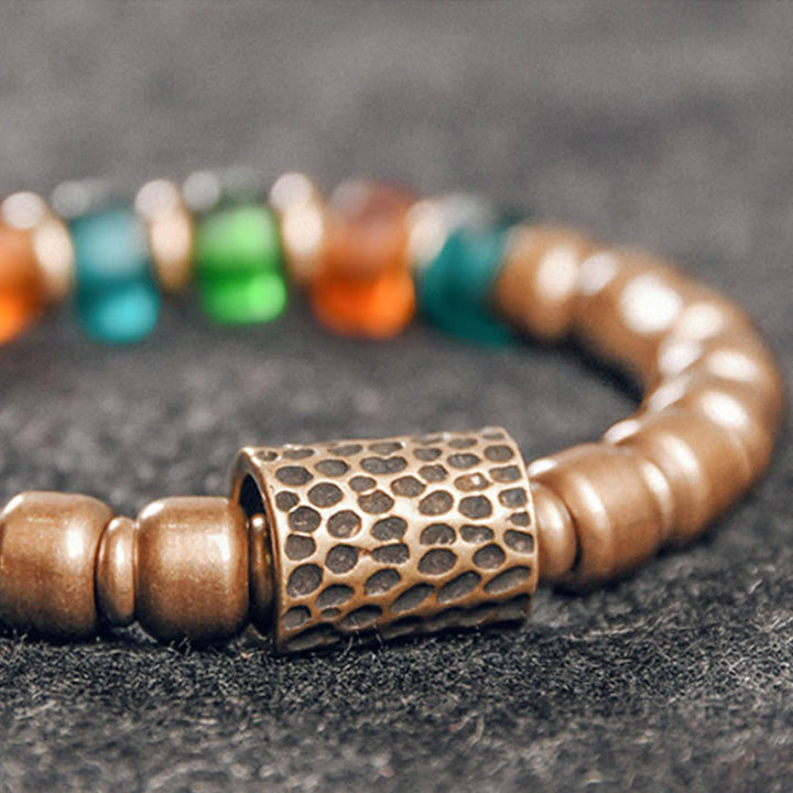 Bracelet tibétain en perles de verre colorées et en cuivre