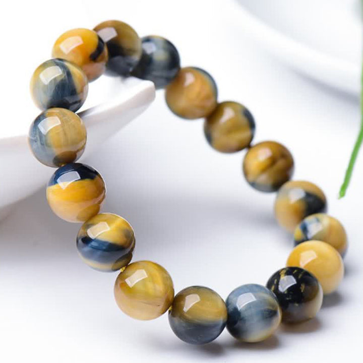 Bracelet de force, de courage et de protection en œil de tigre avec Buddha Stones