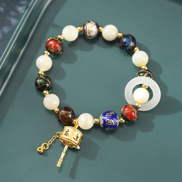 Buddha Stones Encens tibétain Cendres Verre Liuli Pierre Tridacna Pierre de Soleil Om Mani Padme Hum Bracelet à breloques pour roue de prière