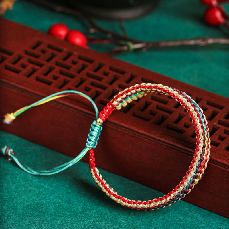 Bracelet tressé de protection multicolore arc-en-ciel fait main en Buddha Stones tibétaines