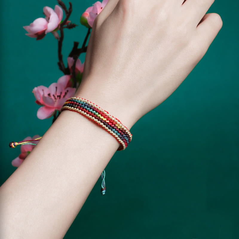 Bracelet tressé de protection multicolore arc-en-ciel fait main en Buddha Stones tibétaines