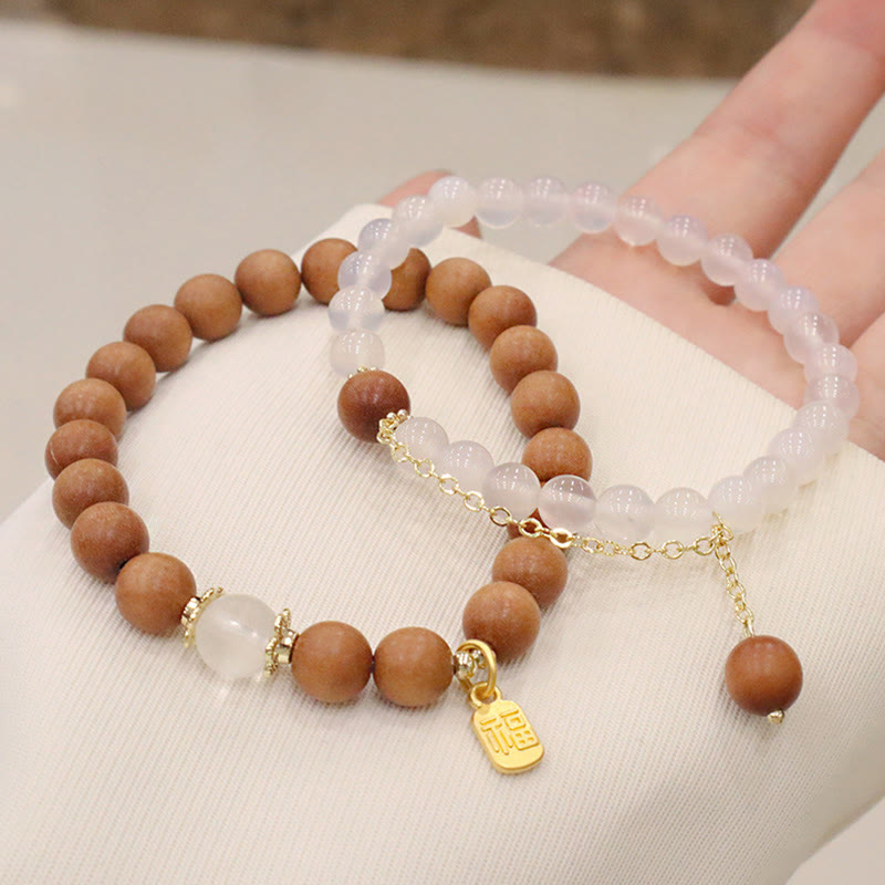 Bracelet de protection à breloques en bois de santal et œil de chat Fu avec Buddha Stones