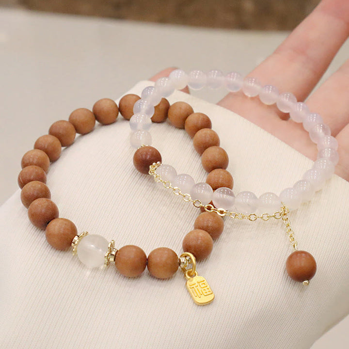 Bracelet de protection à breloques en bois de santal et œil de chat Fu avec Buddha Stones