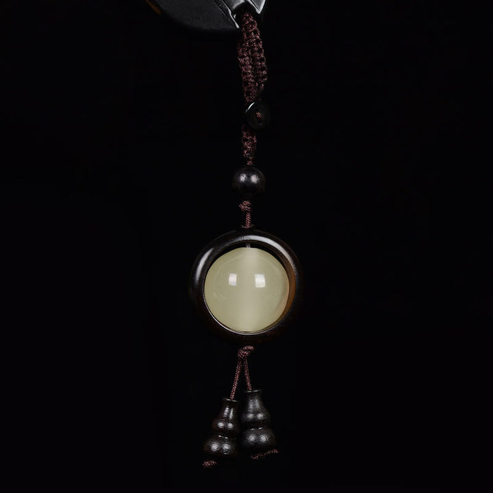 Porte-clés porte-bonheur lumineux en Buddha Stones en bois de santal rouge et bois d'ébène en bois de santal vert