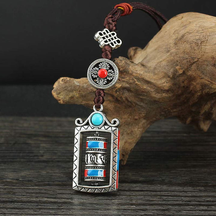 Porte-clés décoratif avec nœud rotatif et bénédiction en forme de roue de prière en six mots vrais en Buddha Stones
