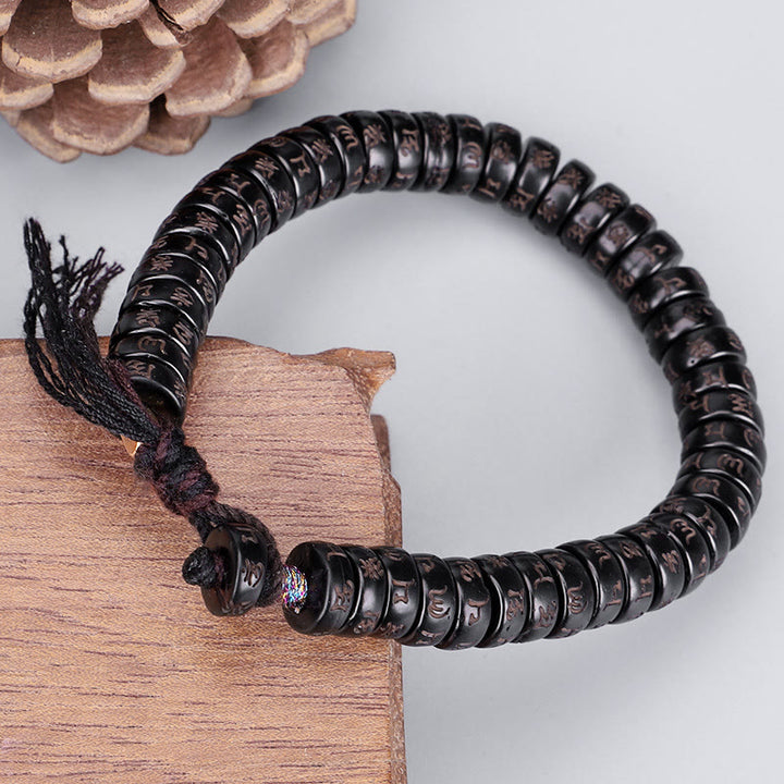 Bracelet en corde Buddha Stones perles de noix de coco tibétaines gravées avec le mantra positif Om Mani Padme Hum
