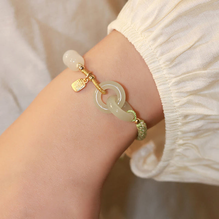Bracelet tressé en perles de jade Hetian naturelles de Buddha Stones avec boucle de paix double et caractère Fu