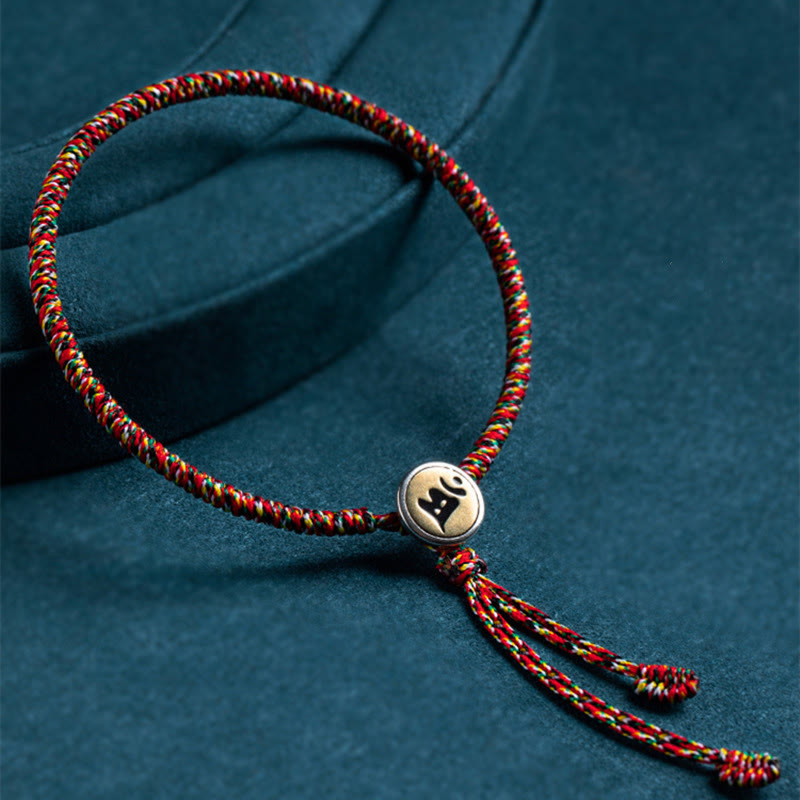 Bracelet en corde colorée, fait main, orné de Buddha Stones, en argent sterling 925 et symbole de protection du zodiaque chinois. - style à pompons - 18 cm - Chien/Cochon - image 0