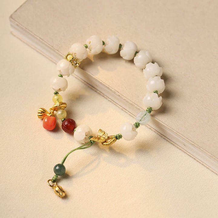 Bracelet d'harmonie et de paix en perles de citrouille et de lotus en Buddha Stones naturelles