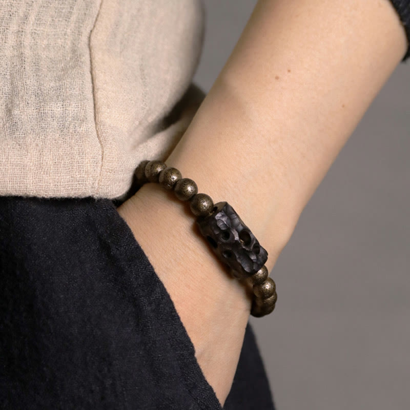 Bracelet de perles en bois d'ébène et cuivre avec Buddha Stones et équilibre