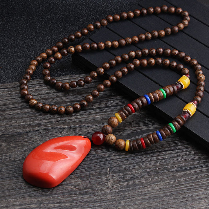 Collier pendentif en Buddha Stones tibétain en bois de wengé Bodhi Seed Agate Balance Peace
