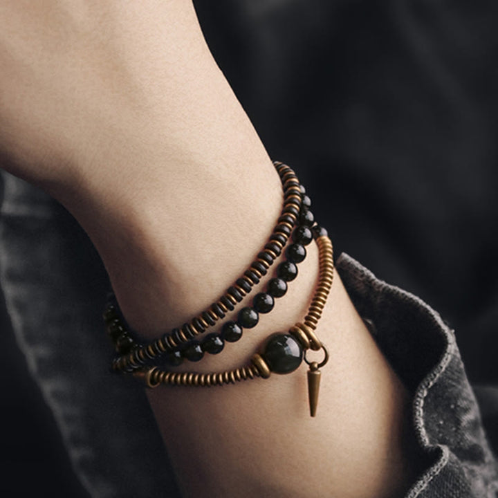 Bracelet triple tour de guérison en cuivre et bois d'ébène avec Buddha Stones arc-en-ciel et obsidienne