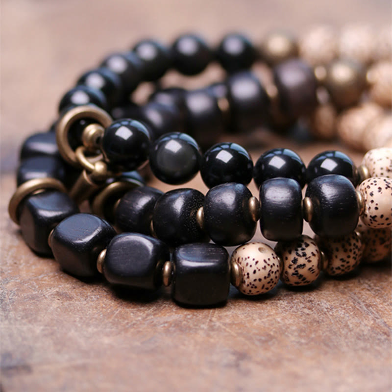 Bracelet de paix en cuivre et bois d'ébène avec Buddha Stones et graines de Bodhi tibétaines