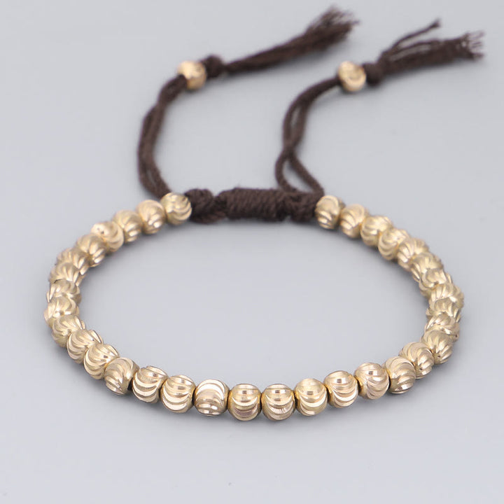 Bracelet porte-bonheur en perles de cuivre tibétaines faites à la main avec Buddha Stones