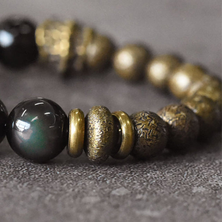 Bracelet de transformation positive en perles de cuivre et obsidienne arc-en Buddha Stones