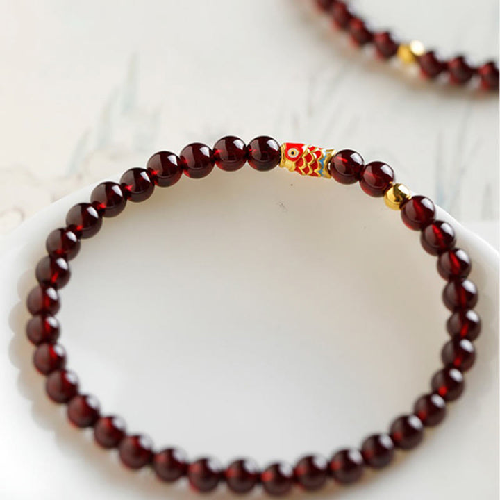 Bracelet de protection en grenat naturel avec poisson koï en or 999 de Buddha Stones - image 4