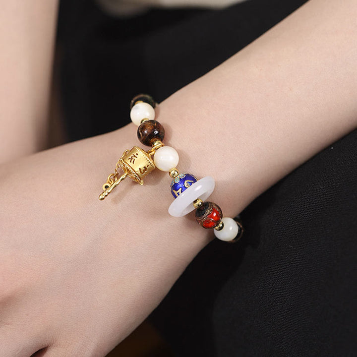 Buddha Stones Encens tibétain Cendres Verre Liuli Pierre Tridacna Pierre de Soleil Om Mani Padme Hum Bracelet à breloques pour roue de prière