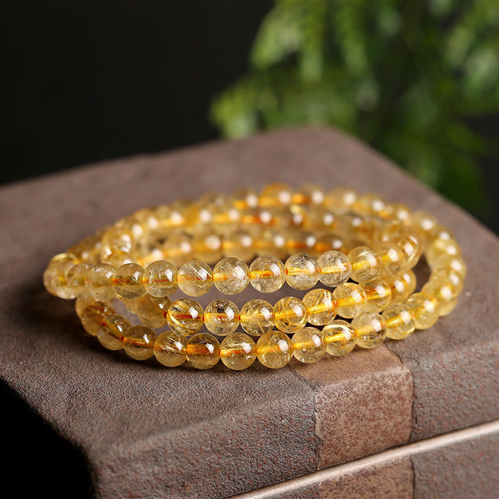 Bracelet de protection et de prospérité en Buddha Stones en citrine naturelle