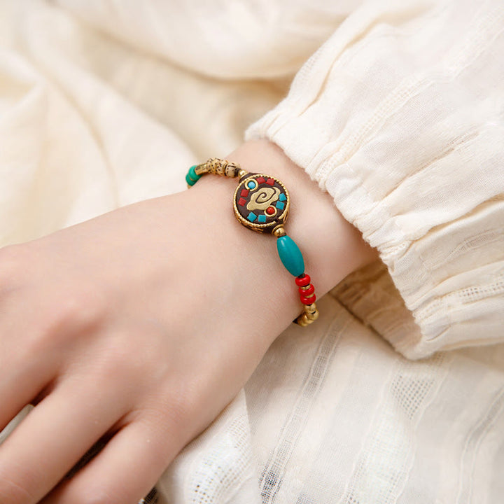 Bracelet de force de protection Om Mani Padme Hum en Buddha Stones tibétaines turquoise
