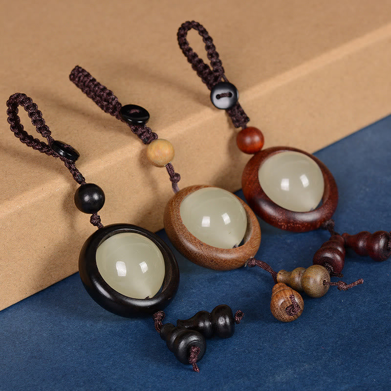 Porte-clés porte-bonheur lumineux en Buddha Stones en bois de santal rouge et bois d'ébène en bois de santal vert