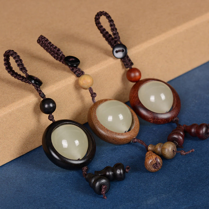 Porte-clés porte-bonheur lumineux en Buddha Stones en bois de santal rouge et bois d'ébène en bois de santal vert
