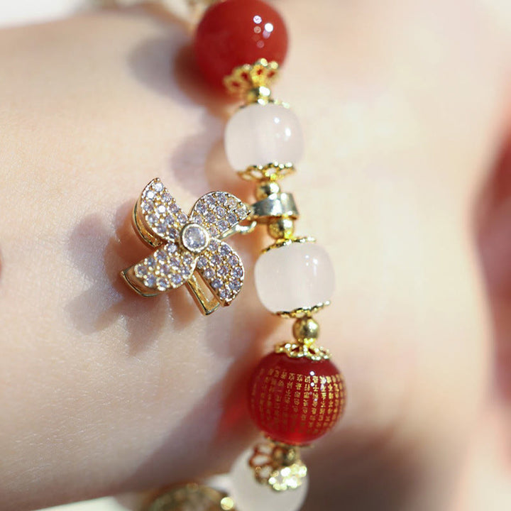 Bracelet de bénédiction avec breloque en forme de moulin à vent en Buddha Stones et caractère Fu