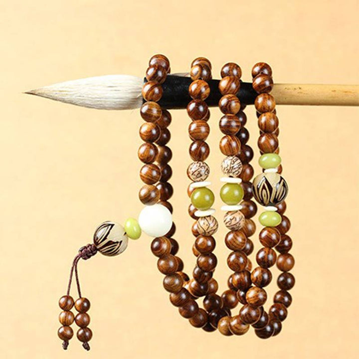 Bracelet Mala tibétain en bois de rose et Buddha Stones pour la protection et le calme
