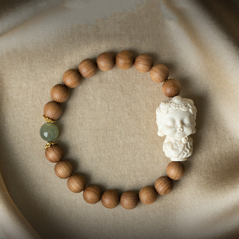 Bracelet de protection Tara verte en Buddha Stones en bois de santal et jade Hetian