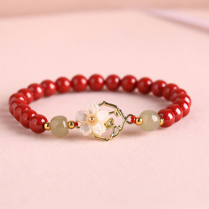 Bracelet de bénédiction en pierre de cinabre naturelle et jade Tridacna avec Buddha Stones