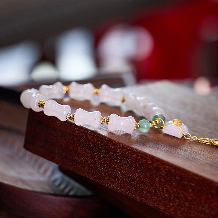 Bracelet en Buddha Stones en soie blanche naturelle dorée et bambou avec motif porte-bonheur et personnage Fu