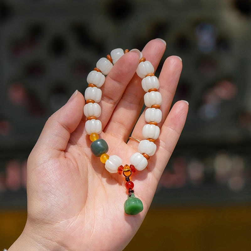 Bracelet en perles de citrouille gravées en agate rouge Bodhi Calme Harmonie Bodhi Graines naturelles Lotus
