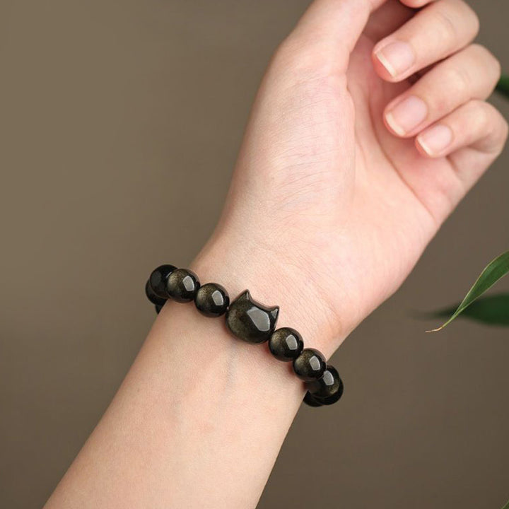 Bracelet de protection porte-bonheur en obsidienne dorée et argentée avec Buddha Stones et jolie patte de chat porte-bonheur - image 7