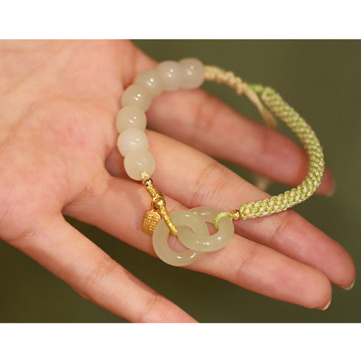 Bracelet tressé en perles de jade Hetian naturelles de Buddha Stones avec boucle de paix double et caractère Fu