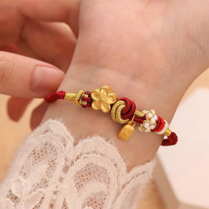 Bracelet porte-bonheur en fil rouge avec Buddha Stones et fleur de pêcher