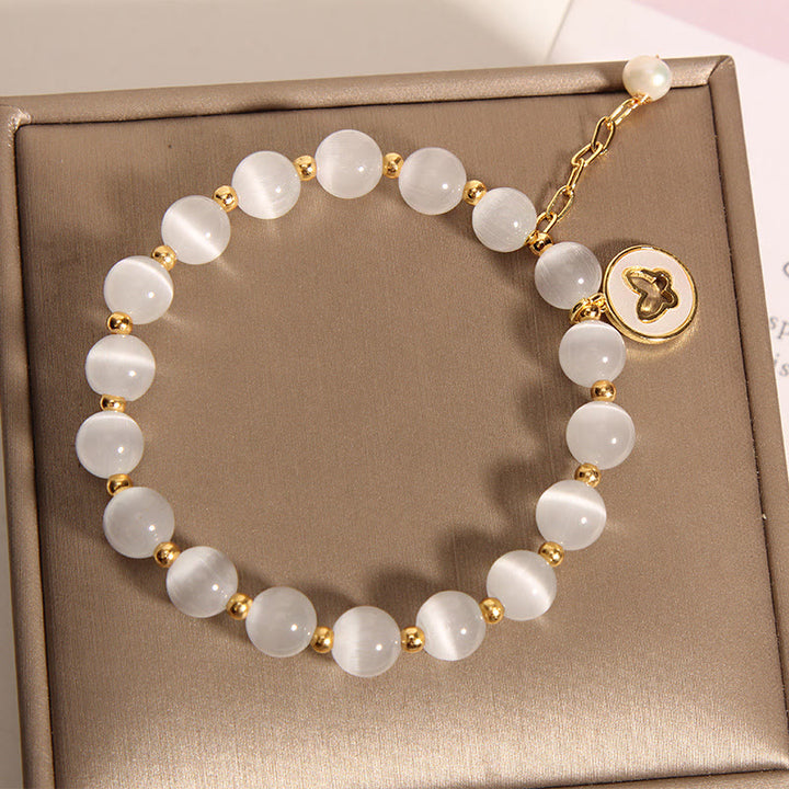 Bracelet d'amour avec breloque papillon œil de chat et Buddha Stones