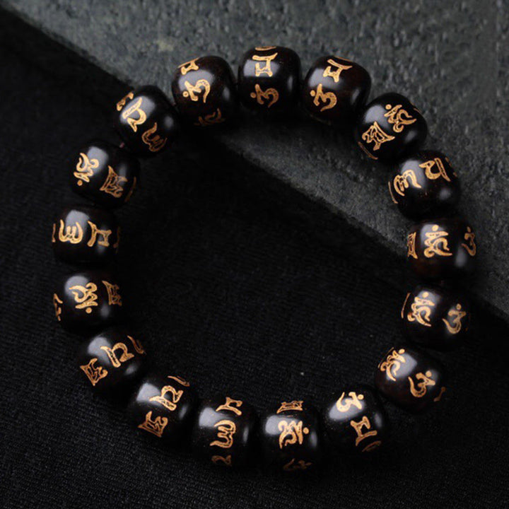 Bracelet de paix gravé en bois d'ébène tibétain avec Buddha Stones Om Mani Padme Hum