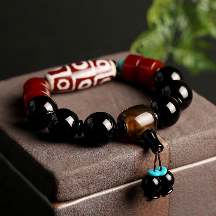 Bracelet tibétain de protection de richesse en onyx noir avec perles dzi à neuf yeux