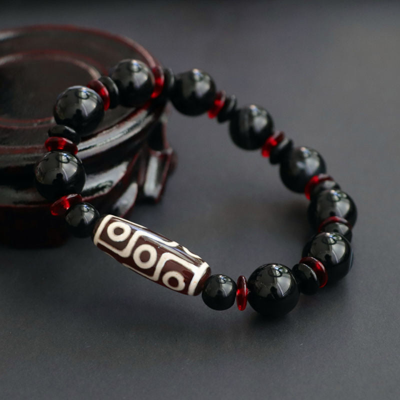 Bracelet de protection de richesse en perles dzi à neuf yeux en onyx noir de Buddha Stones
