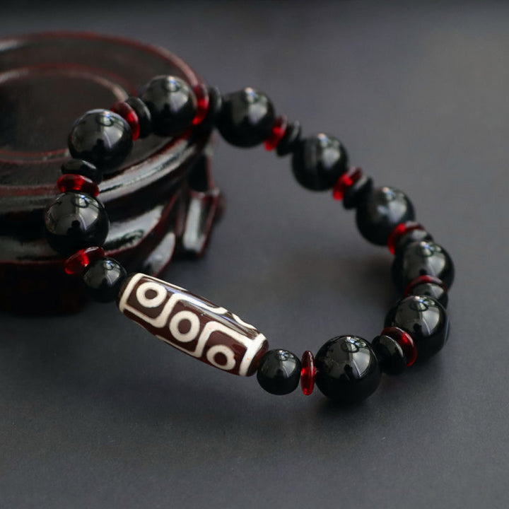 Bracelet de protection de richesse en perles dzi à neuf yeux en onyx noir de Buddha Stones