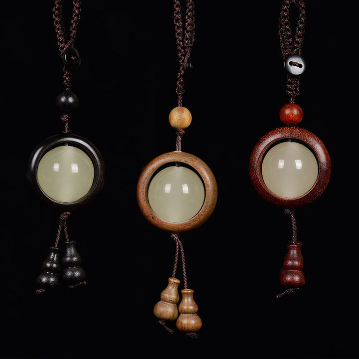 Porte-clés porte-bonheur lumineux en Buddha Stones en bois de santal rouge et bois d'ébène en bois de santal vert