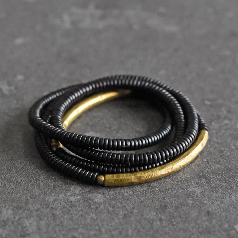 Bracelet multicouches en bois d'ébène et cuivre avec Buddha Stones